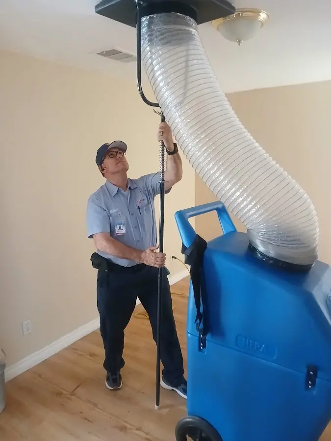 Furnace Tune-Up technician using HEPA equipment in Bloomingdale